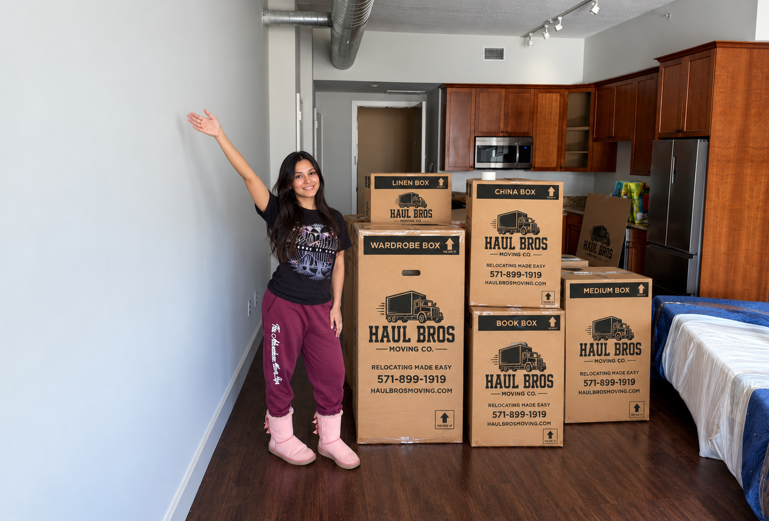Customer smiling beside Haul Bros moving boxes