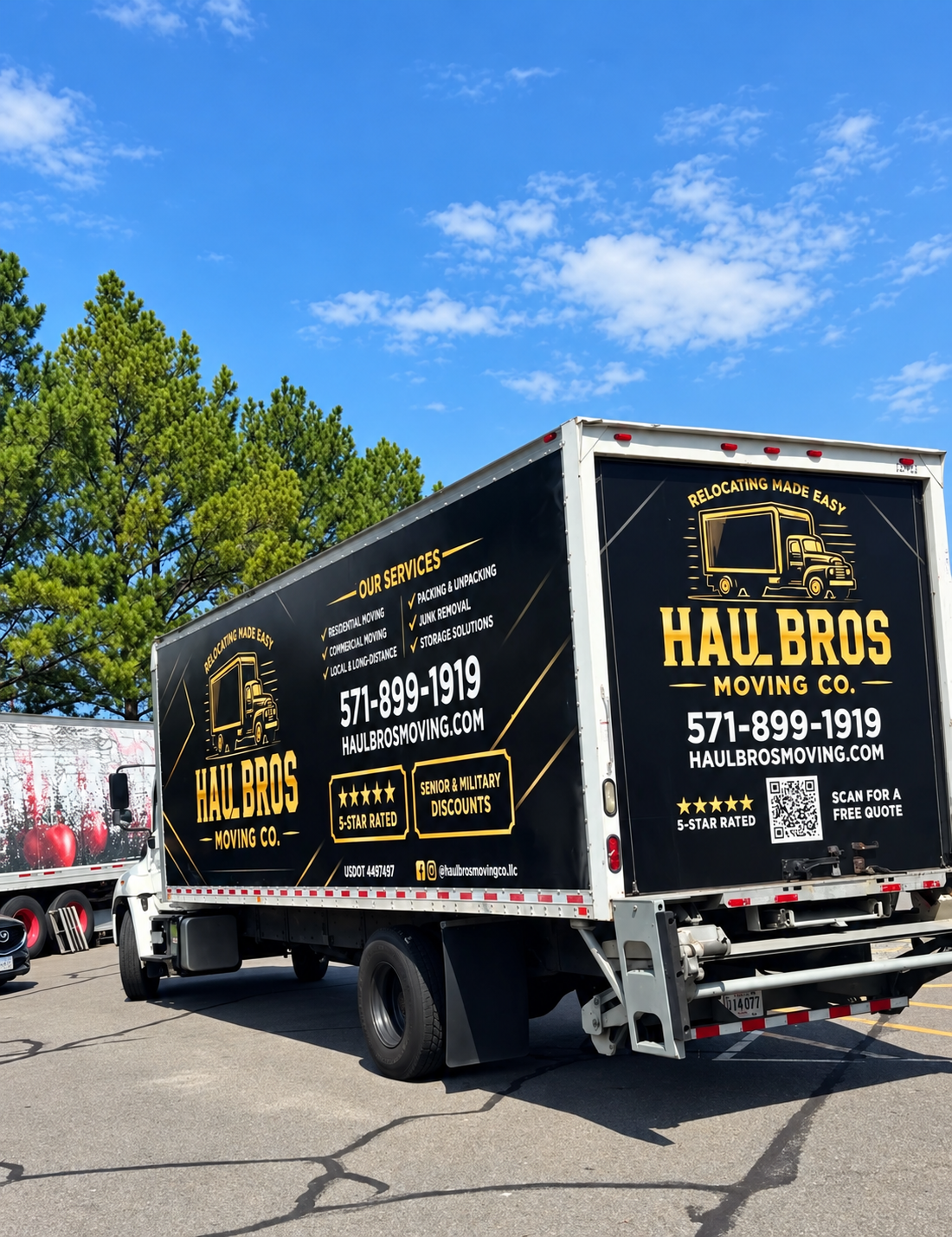 Black-and-gold Haul Bros moving truck parked in sunlight
