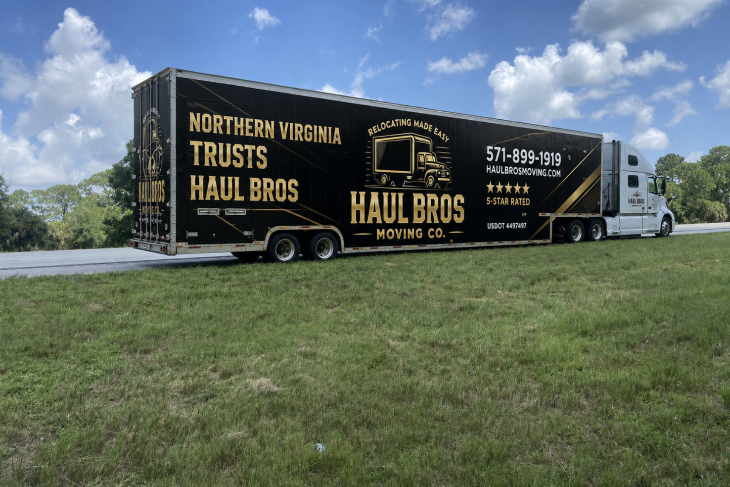 Black-and-gold Haul Bros moving truck parked beside a road