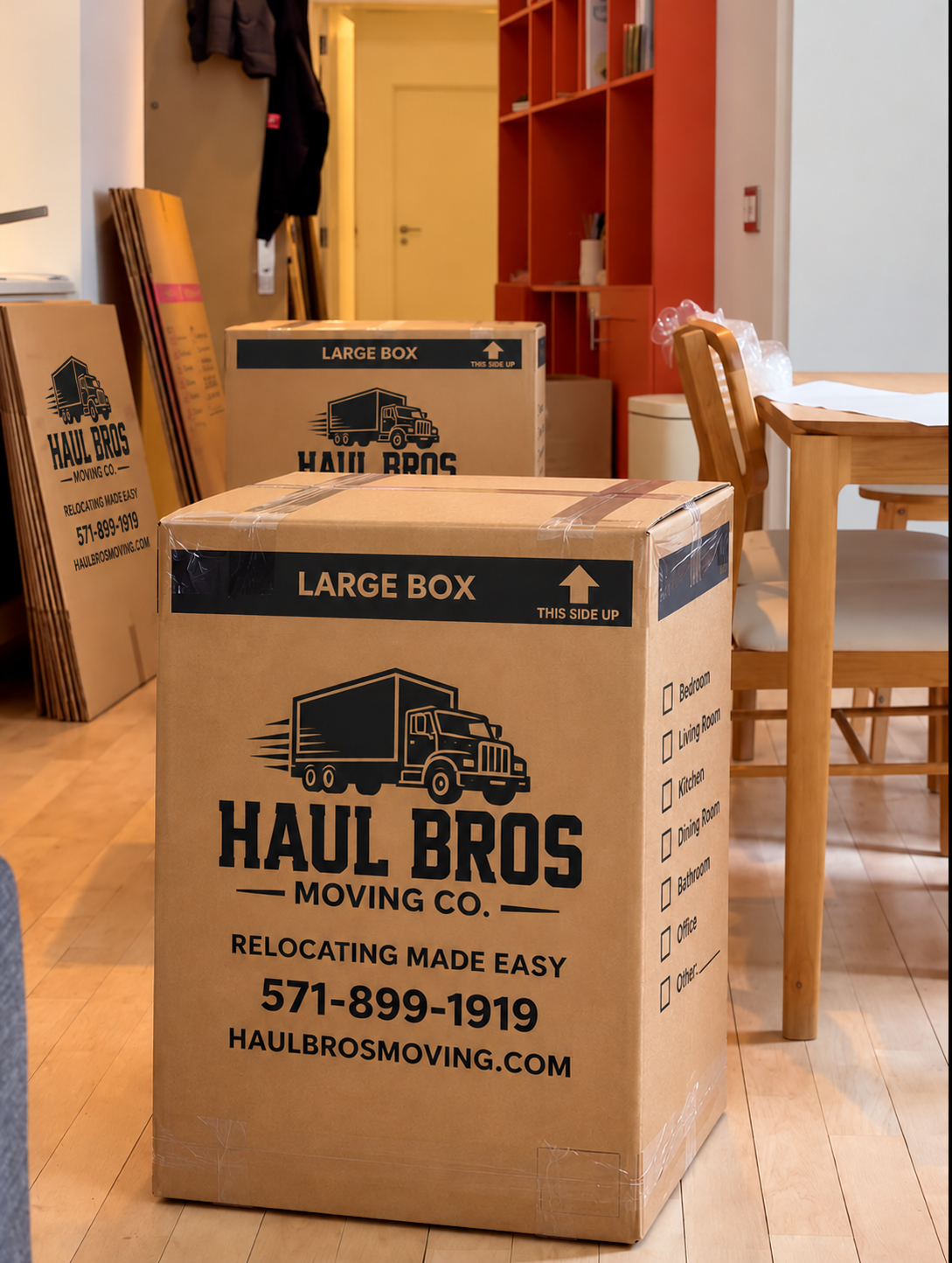 Haul Bros branded moving boxes in a furnished apartment