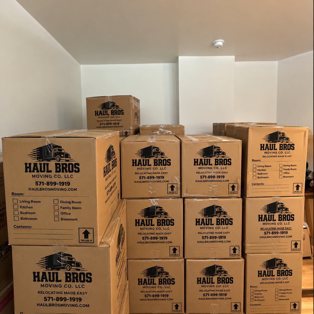 Sealed Haul Bros moving boxes stacked inside a room